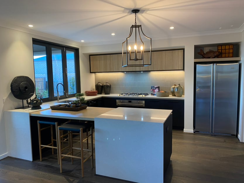 Kitchen with island, lighting and integrated storage