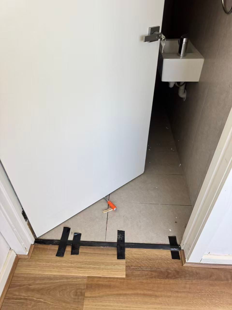 Doorway flooring transition held for alignment