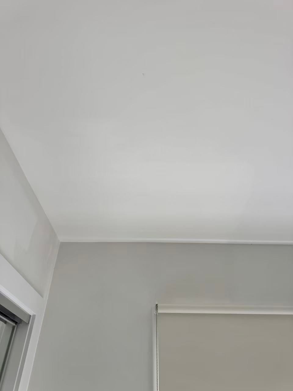 Repaired ceiling surface above an interior window